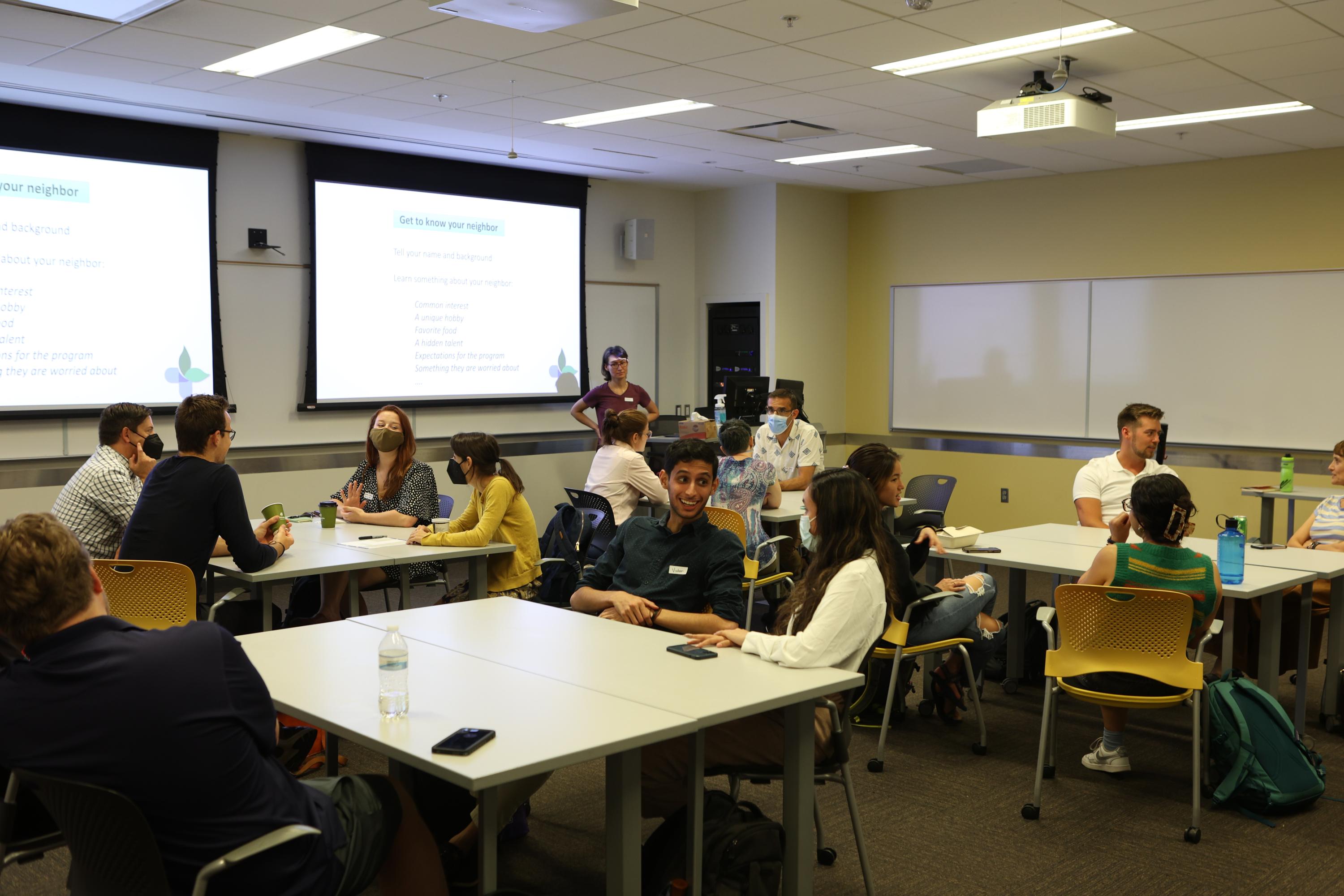 Members of the inaugural cohort of fellows for the Interdisciplinary Health and Environment Leadership Development (IHE-LeaD) Program discuss program goals. 