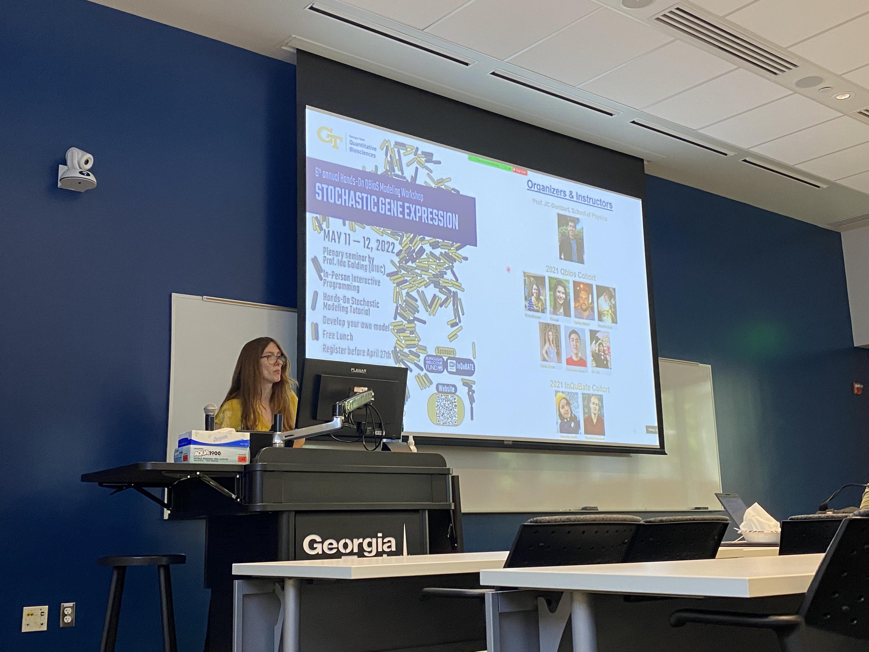 Adriana Lucia-Sanz, postdoctoral researcher in the Weitz Group at Georgia Tech, which is led by Joshua Weitz, professor and founding director of the Quantitative Biosciences program, delivering the opening lecture.