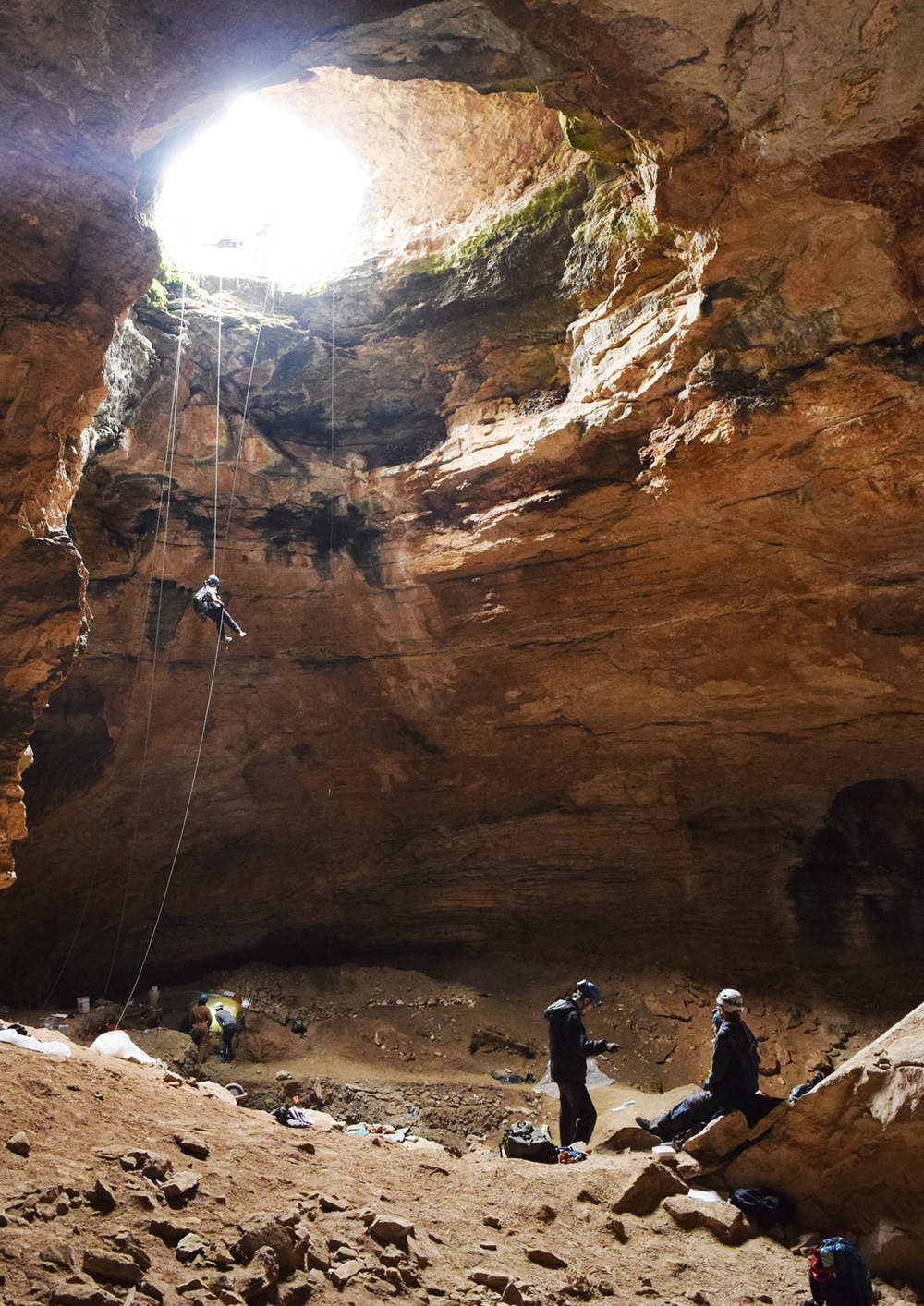 Jenny McGuire rappels into Natural Trap Cave in northern Wyoming. (Photo: Jess Hunt-Ralston)