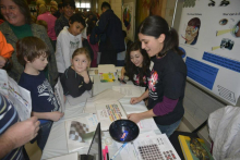 Christina Ragan challenging attendees with optical illusions at a previous Brain Awareness Day Neuroscience event held at Michigan State University. Christina Ragan challenging attendees with optical illusions at a previous Brain Awareness Day Neuroscience event held at Michigan State University.
